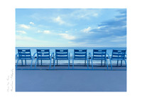 Fine Art Print of the iconic blue chairs along the Nice seafront with blue skies and clouds, great for offices and modern decor.
