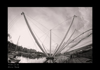 A3-sized black-and-white fine art print in copper tones of Renzo Piano’s Bigo in Genoa, an artistic photograph taken with a fisheye lens and a black border